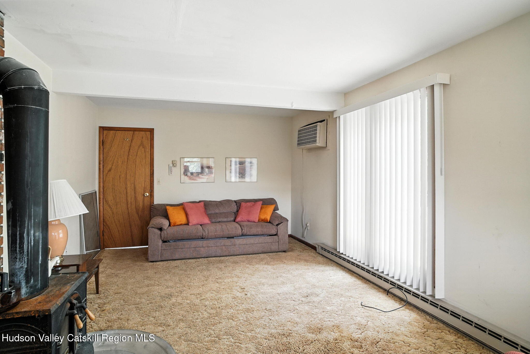 136 Kautz Road Callicoon, NY 12723 - Photo 12 of 51 a living room with furniture and a flat screen tv