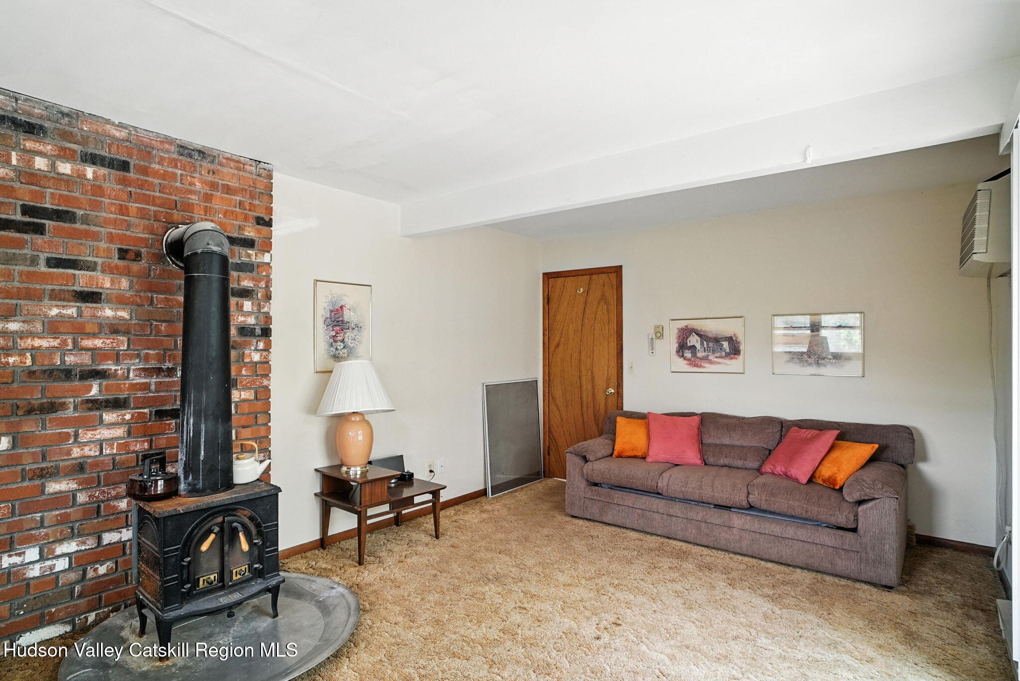 136 Kautz Road Callicoon, NY 12723 - Photo 13 of 51 a living room with furniture and a fireplace