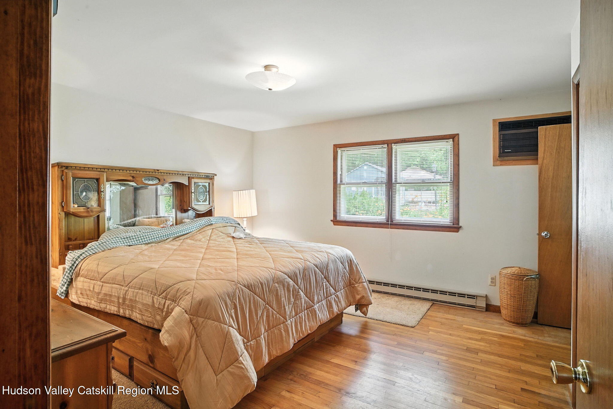 136 Kautz Road Callicoon, NY 12723 - Photo 14 of 51 a bedroom with a bed and wooden floor