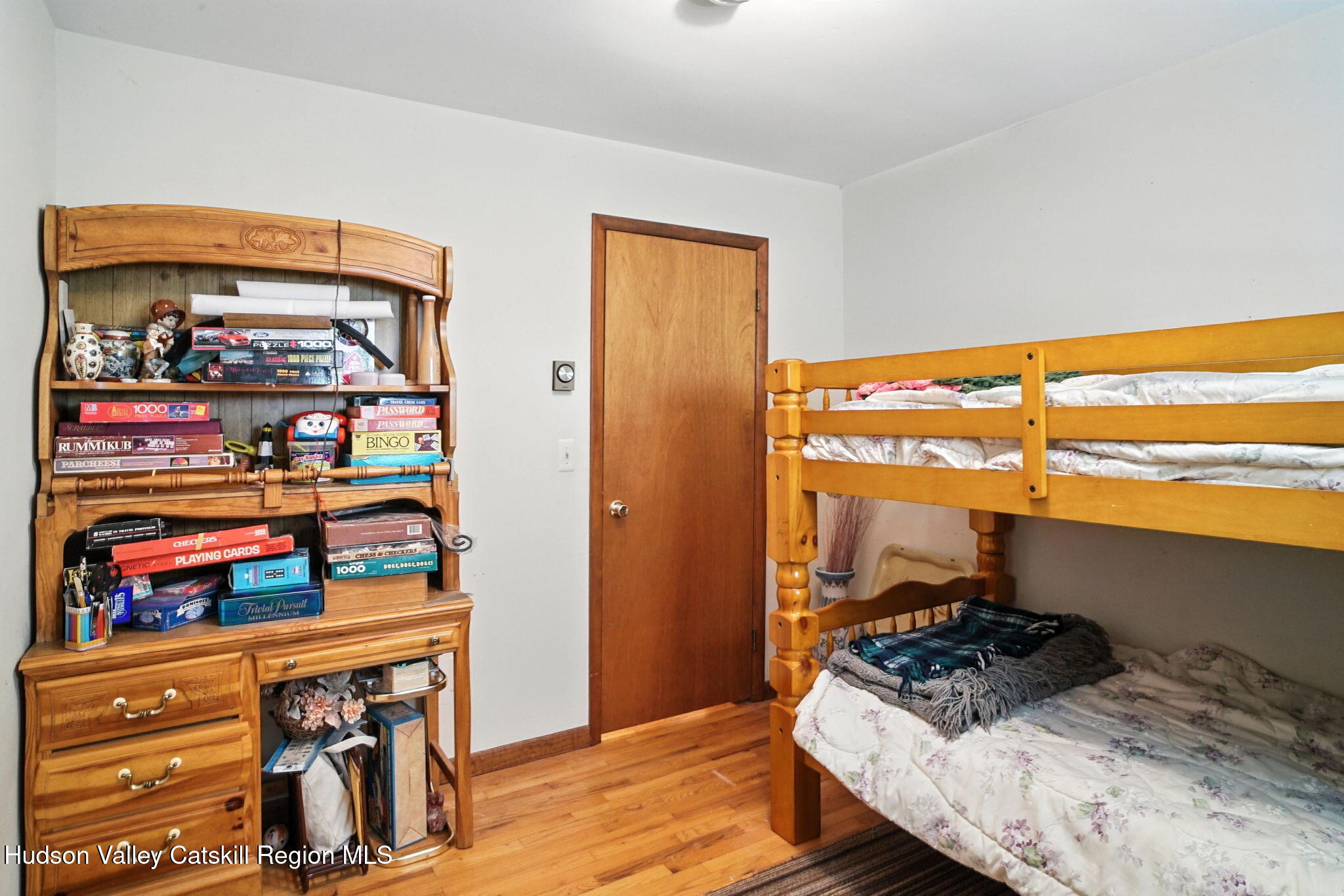 136 Kautz Road Callicoon, NY 12723 - Photo 15 of 51 a bedroom with a bed and a window