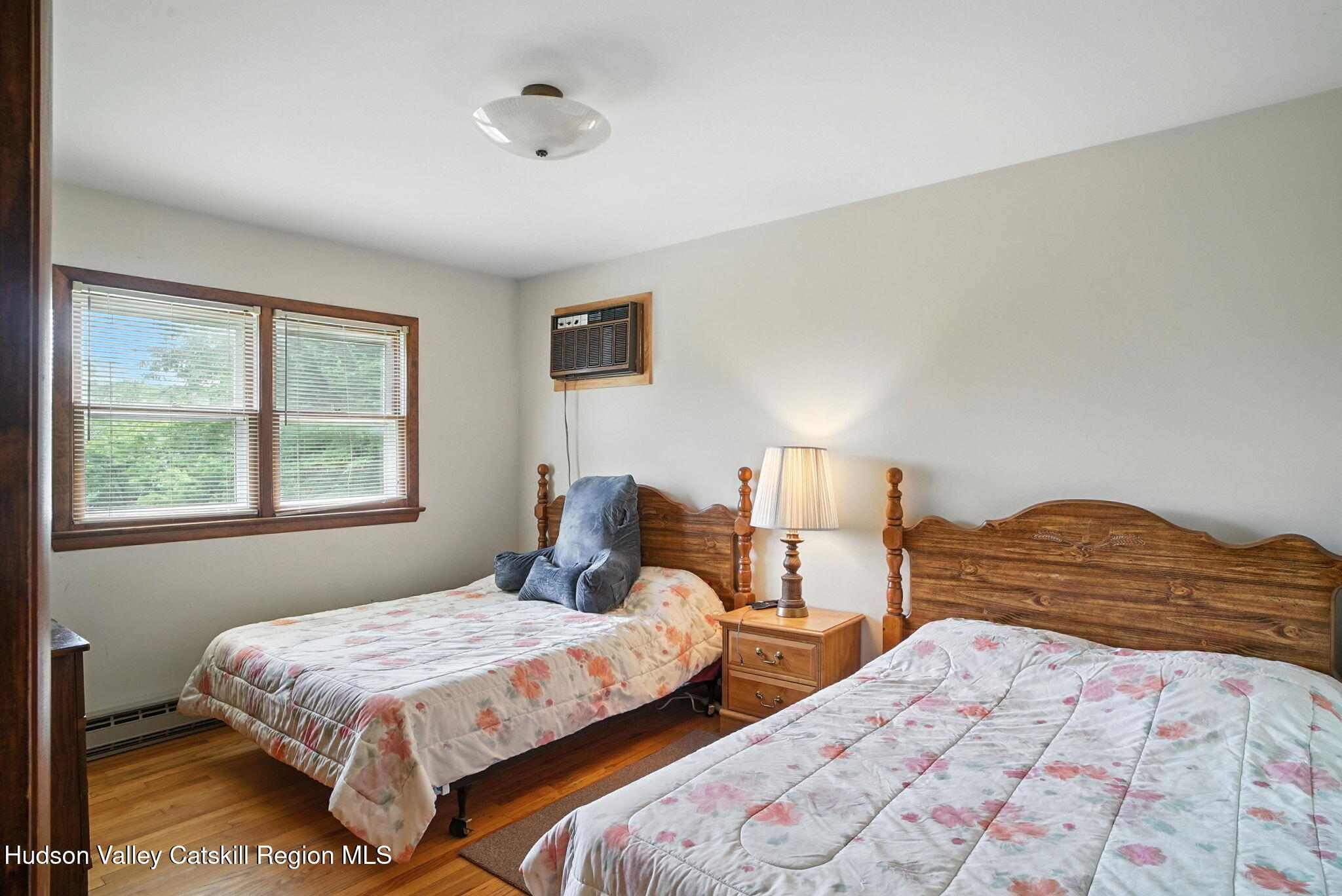 136 Kautz Road Callicoon, NY 12723 - Photo 18 of 51 a bedroom with two beds and a window