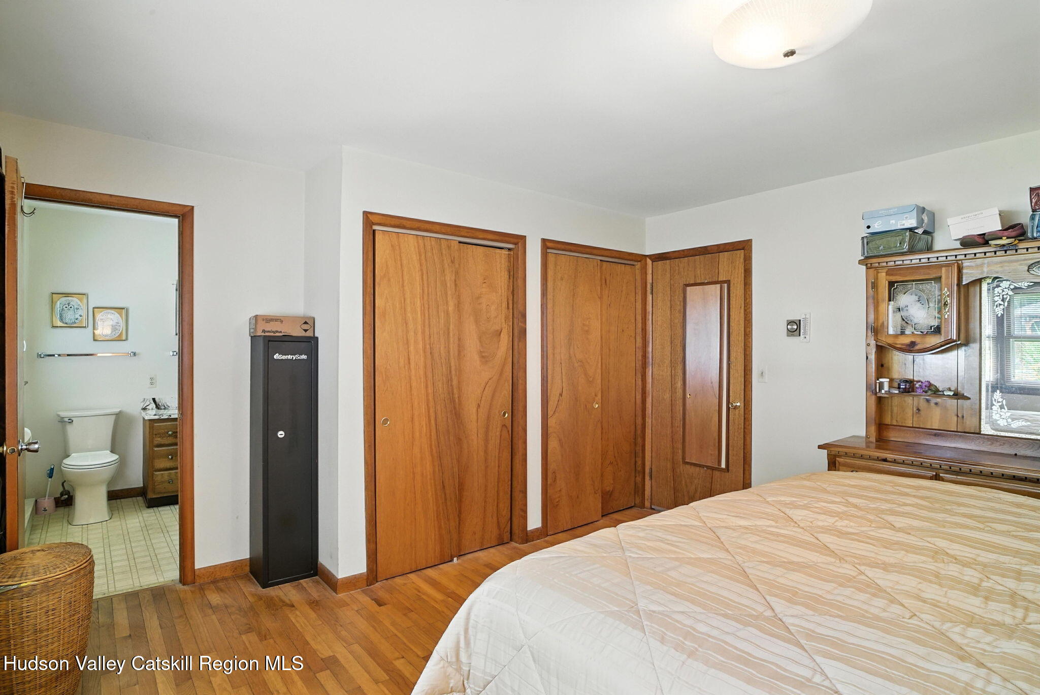 136 Kautz Road Callicoon, NY 12723 - Photo 19 of 51 a bedroom with a bed and wooden floor