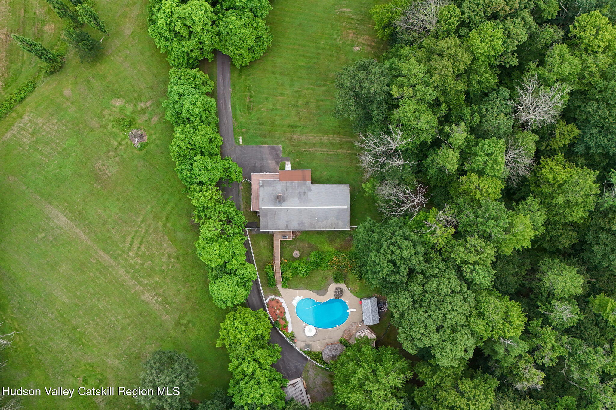 136 Kautz Road Callicoon, NY 12723 - Photo 3 of 51 an aerial view of a house with a yard and large trees