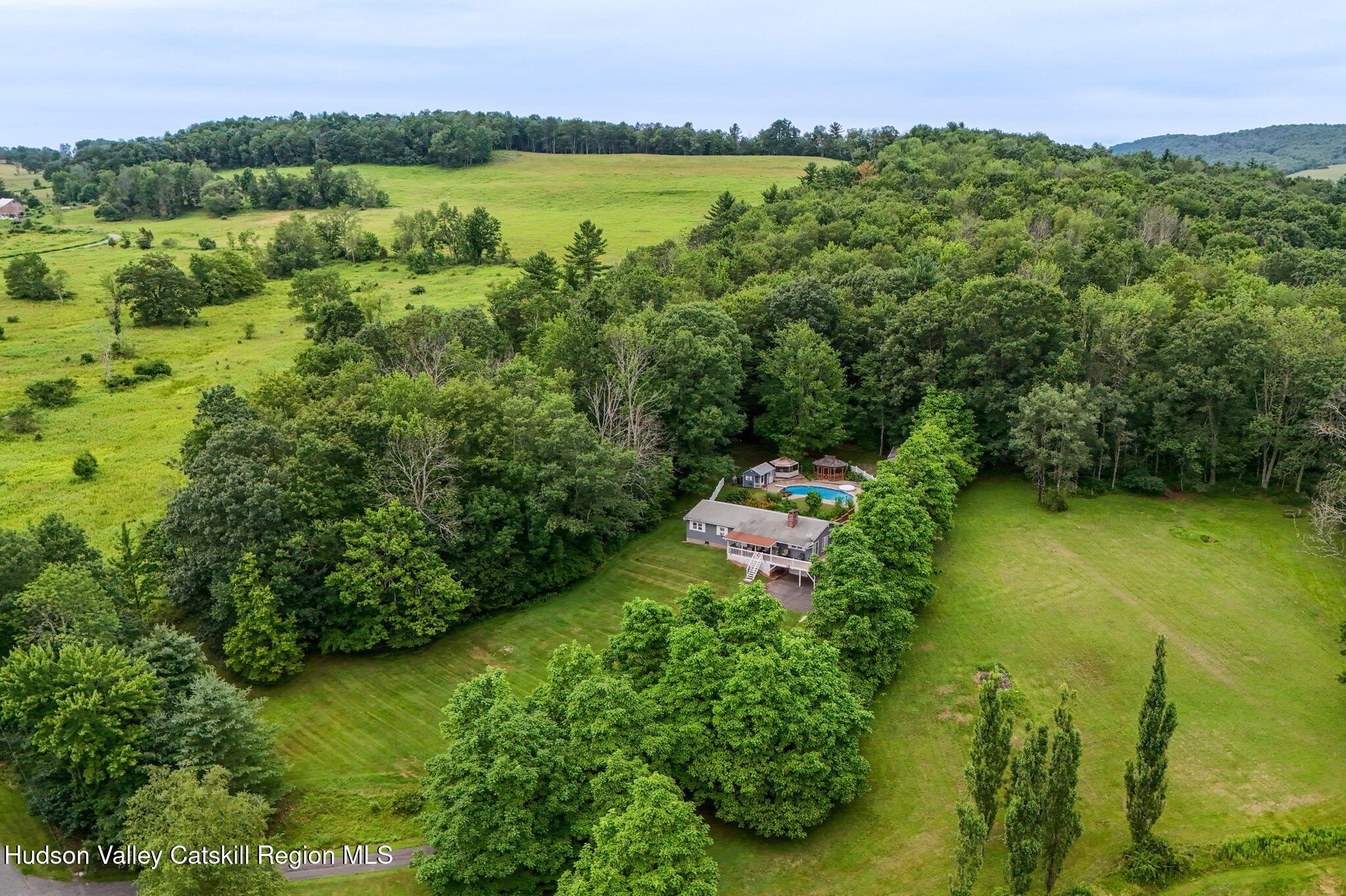 136 Kautz Road Callicoon, NY 12723 - Photo 50 of 51 a view of a lake with a mountain in the background