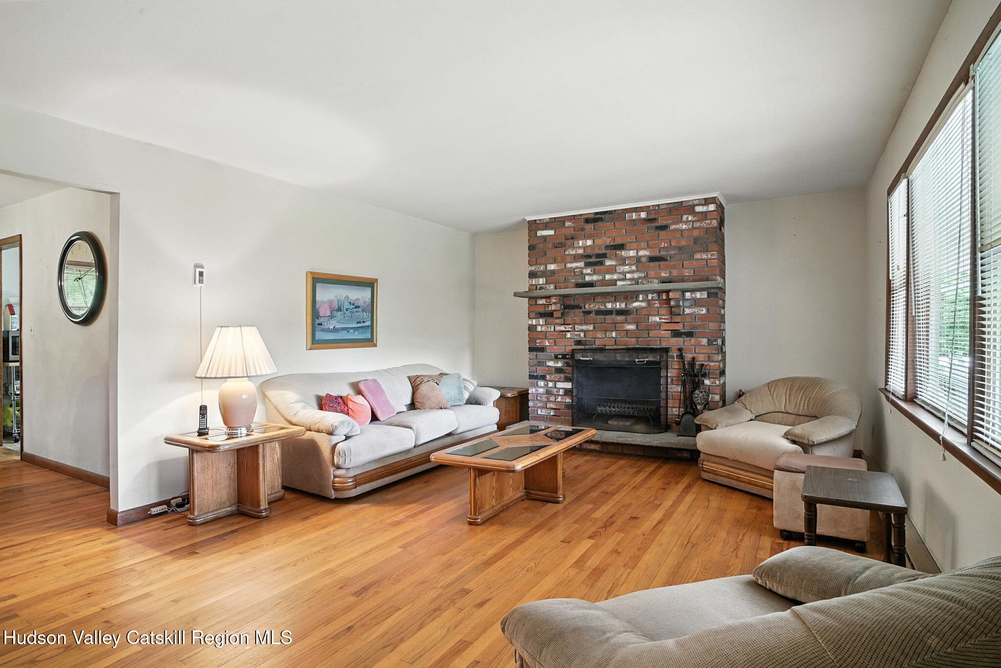 136 Kautz Road Callicoon, NY 12723 - Photo 5 of 51 a living room with furniture a fireplace and a large window