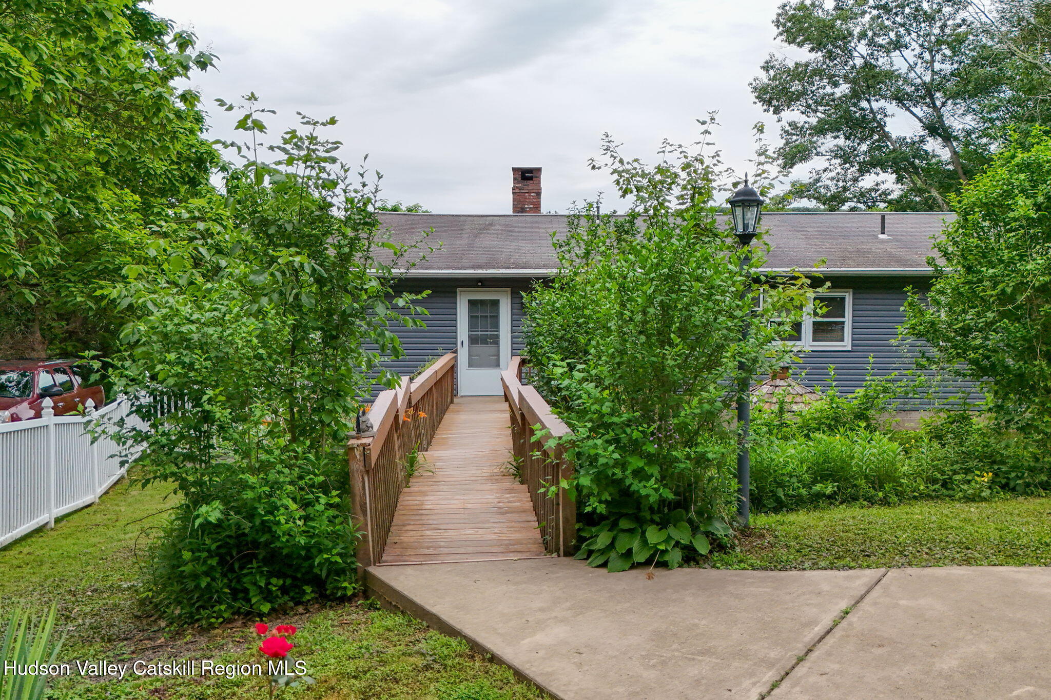 136 Kautz Road Callicoon, NY 12723 - Photo 51 of 51 a front view of a house with a yard and potted plants