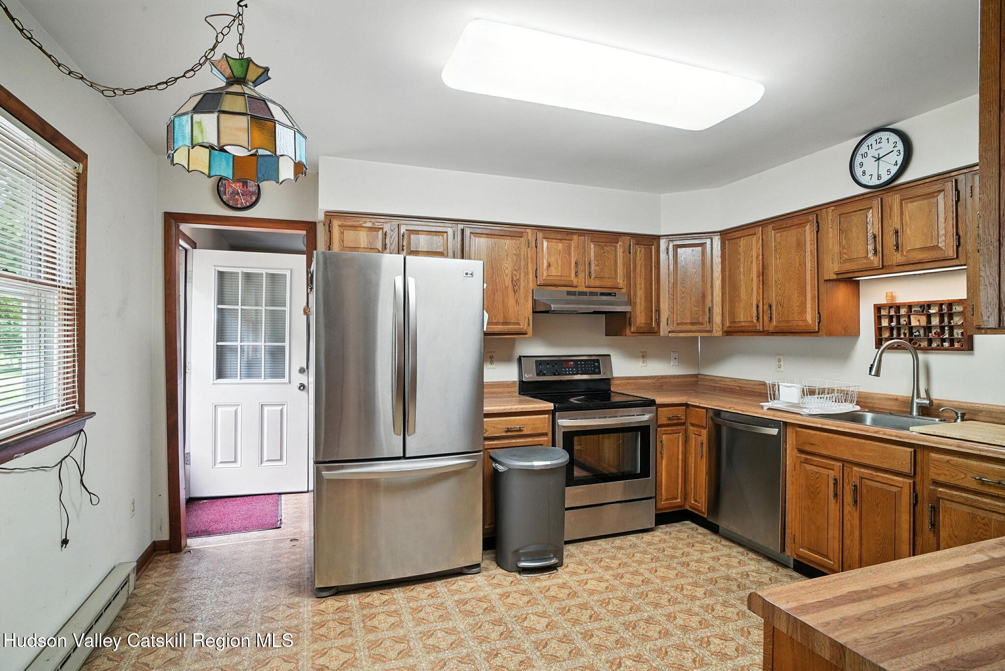 136 Kautz Road Callicoon, NY 12723 - Photo 10 of 51 a kitchen with stainless steel appliances granite countertop a refrigerator a sink dishwasher a stove and a dining table with wooden floor