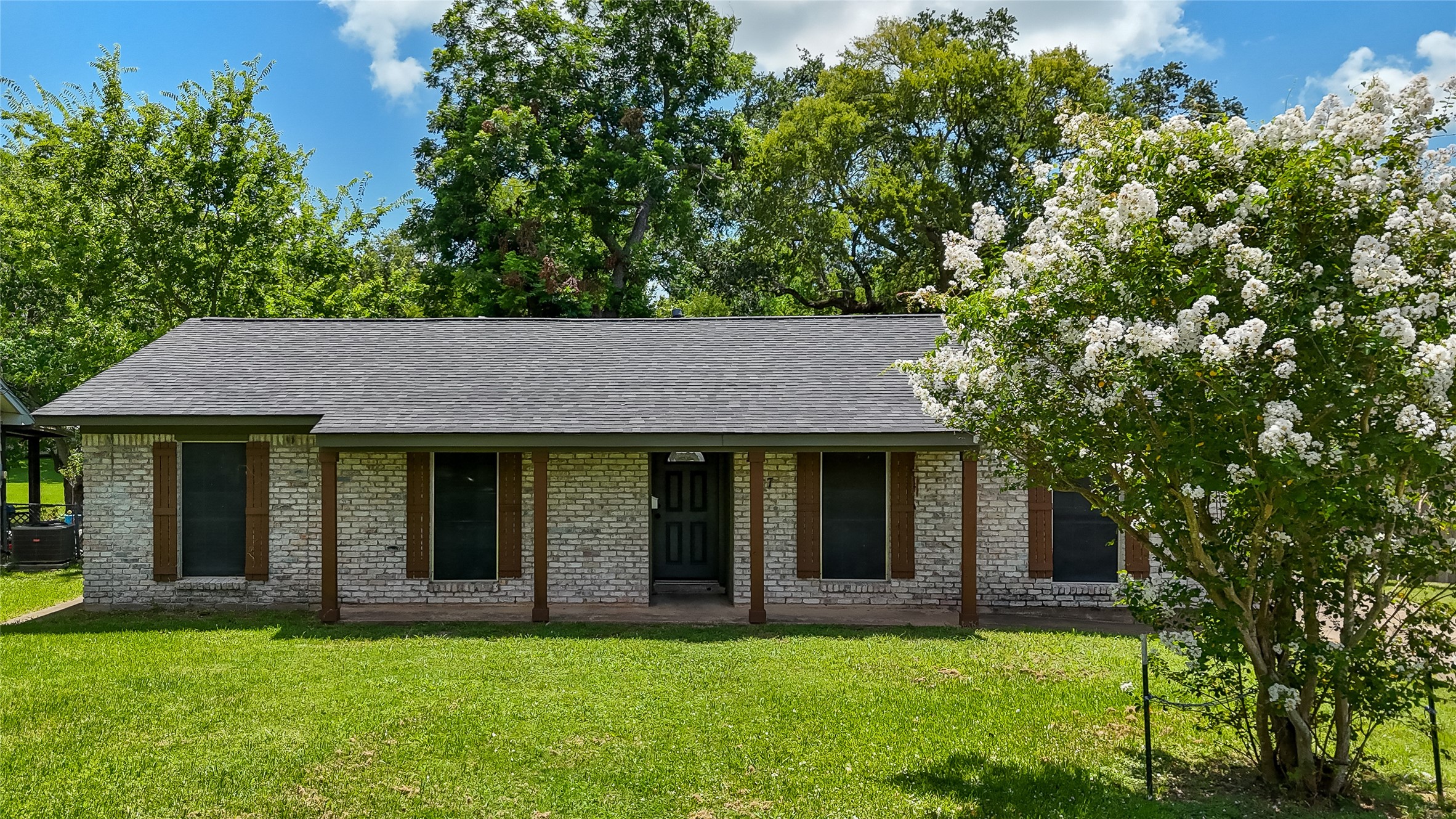 Welcome to 117 Cannon Street in Clute, where mature trees, a spacious lawn and classic brick curb appeal create an inviting welcome near schools, restaurants and local amenities.