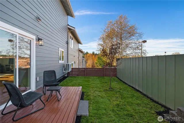 a view of a patio with chair and table back yard of the house