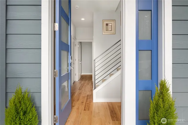 a view of a hallway with a potted plant