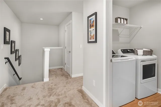 a view of a storage & utility room with washer and dryer