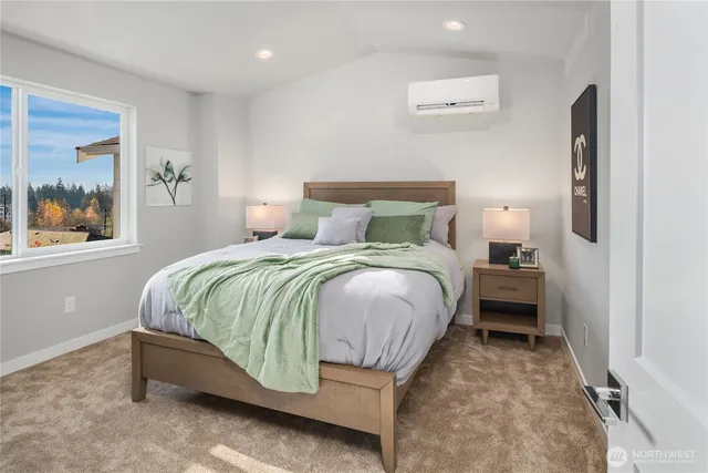 a bedroom with a bed and glass window