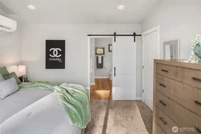 a bedroom with a bed and a walk in closet