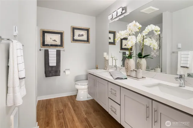a spacious bathroom with a double vanity sink mirror and