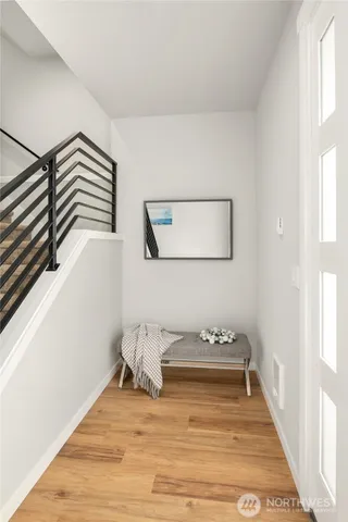 a bathroom with a bathtub and a window