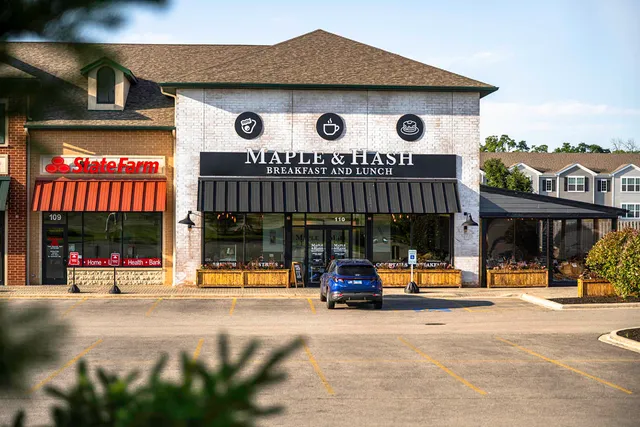 a view of a building with car parked