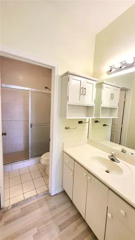 a bathroom with a shower and a toilet
