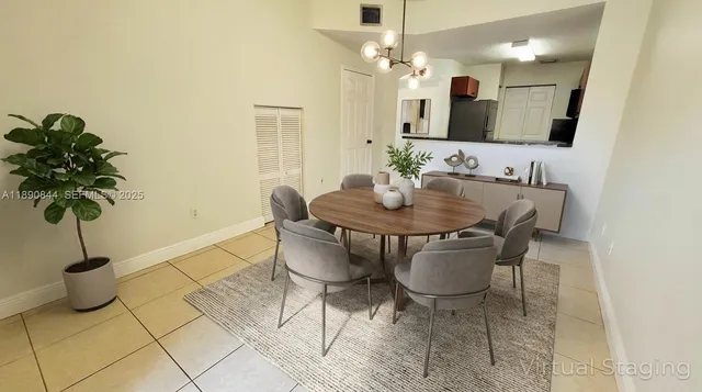 a kitchen with a refrigerator and a stove