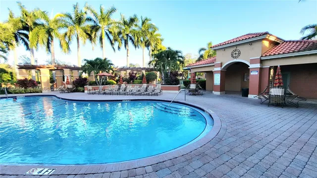 a view of a swimming pool with a garden