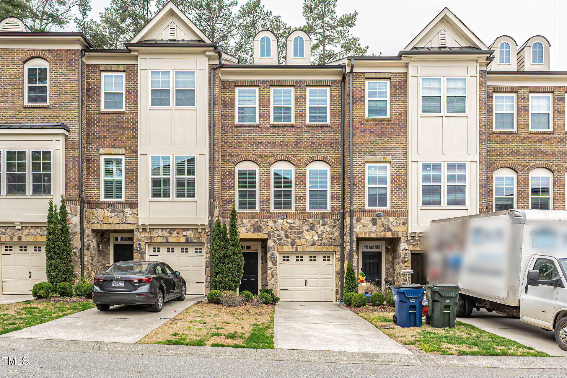 a front view of a house with parking space