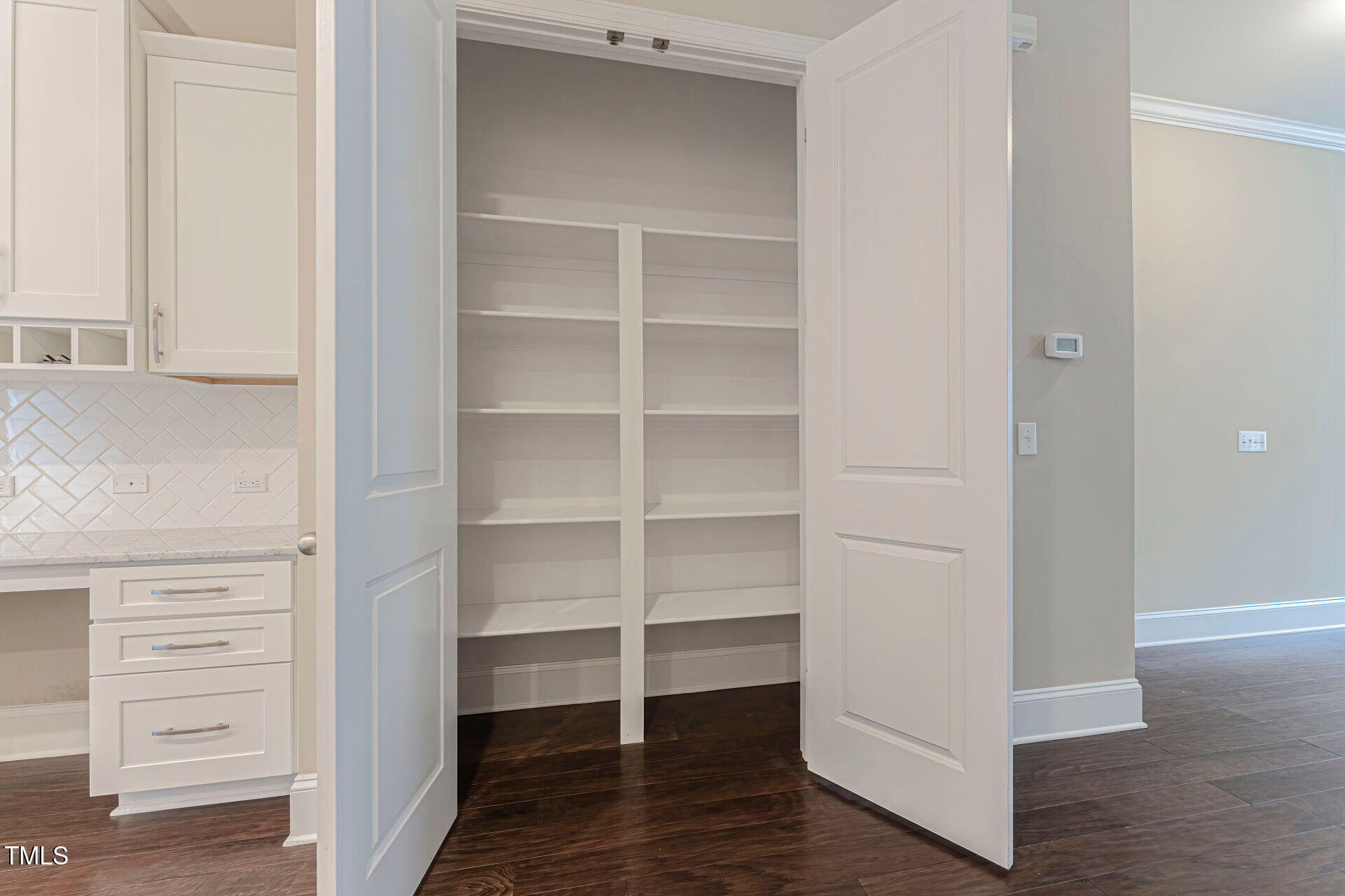 3606 Winifred Way Raleigh, NC 27609 - Photo 16 of 45 a view of walk in closet with empty racks