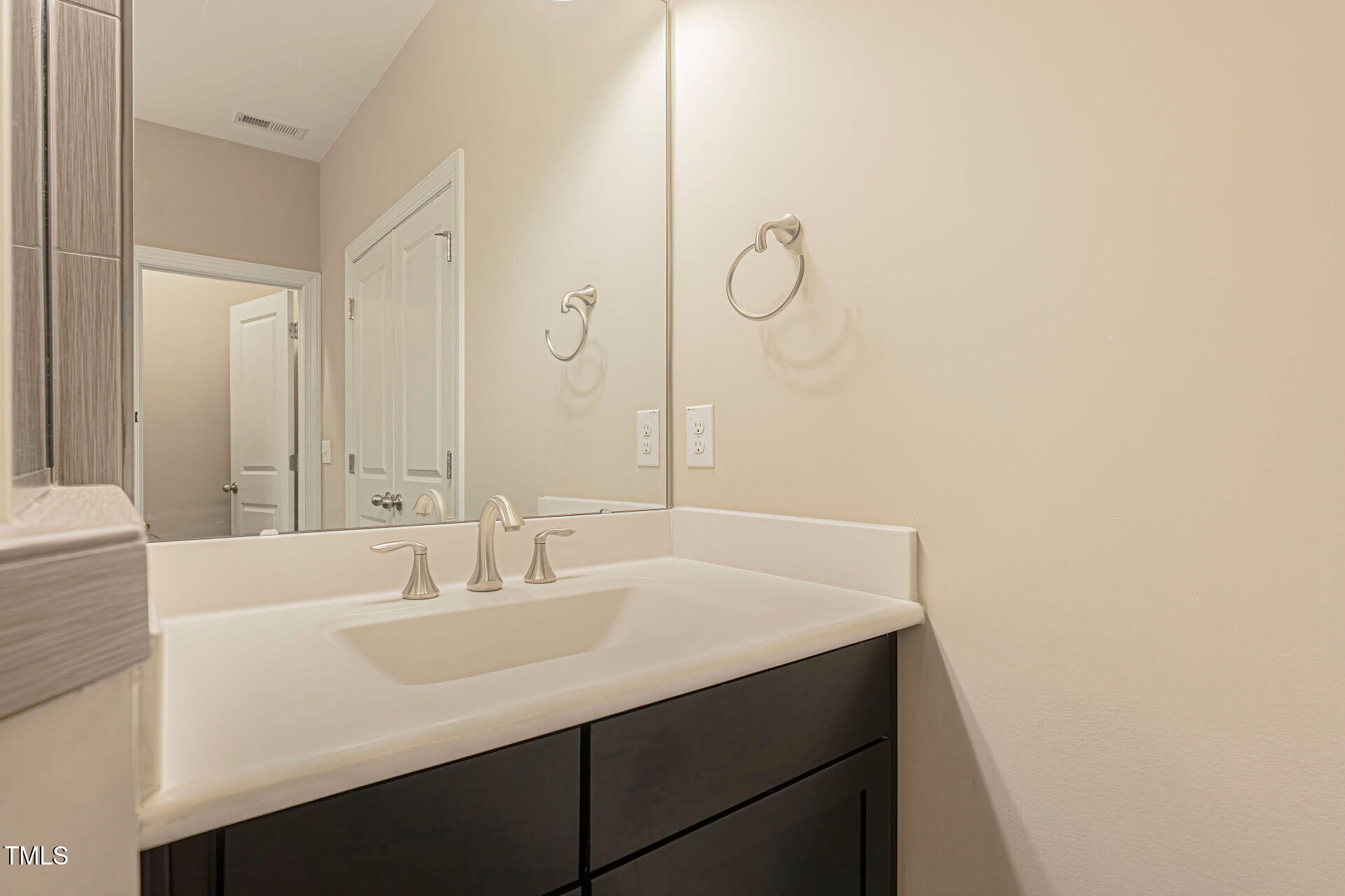 3606 Winifred Way Raleigh, NC 27609 - Photo 33 of 45 a bathroom with a sink and a mirror