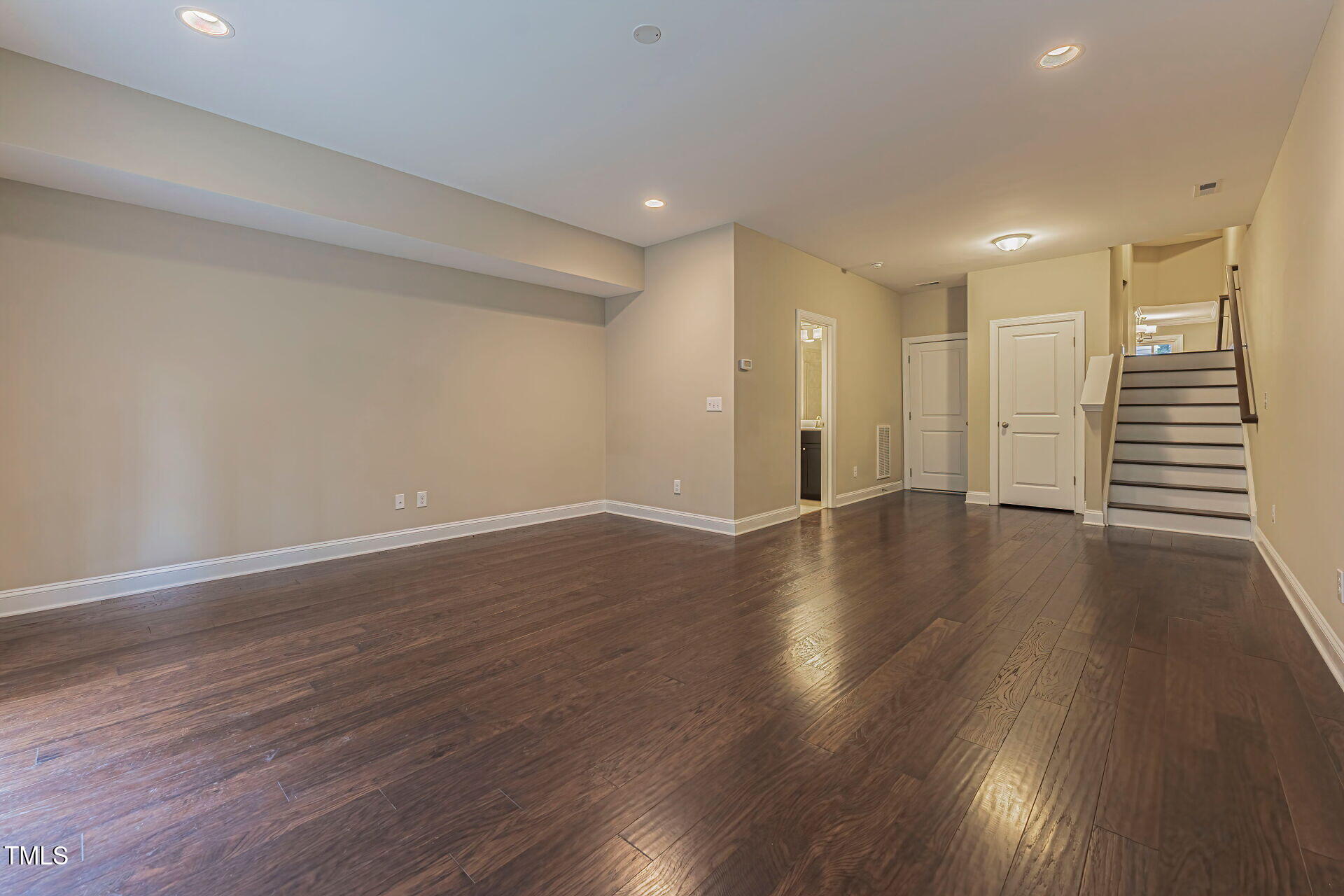 3606 Winifred Way Raleigh, NC 27609 - Photo 36 of 45 a view of a room with wooden floors and stairs