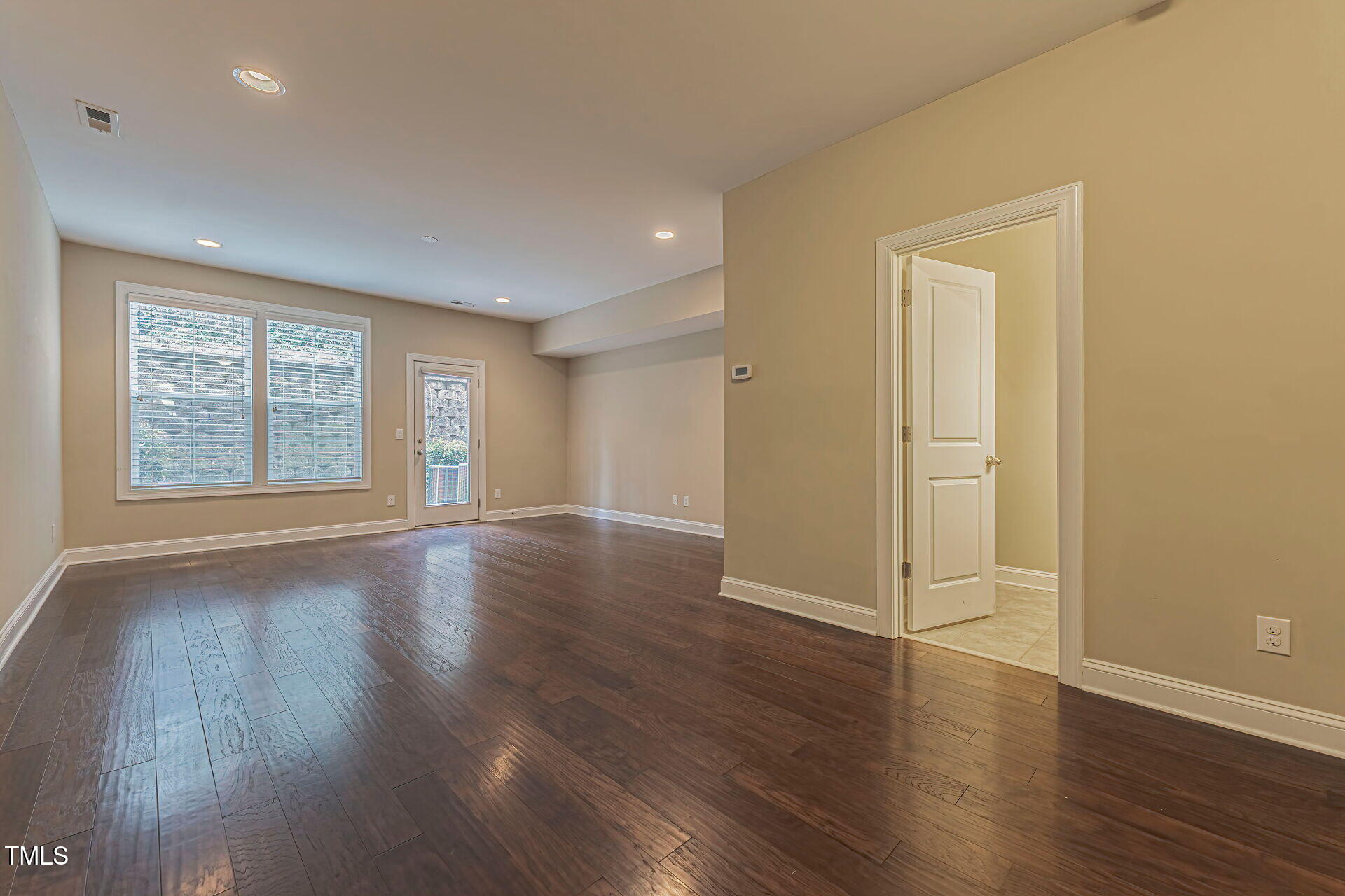 3606 Winifred Way Raleigh, NC 27609 - Photo 38 of 45 an empty room with wooden floor and windows