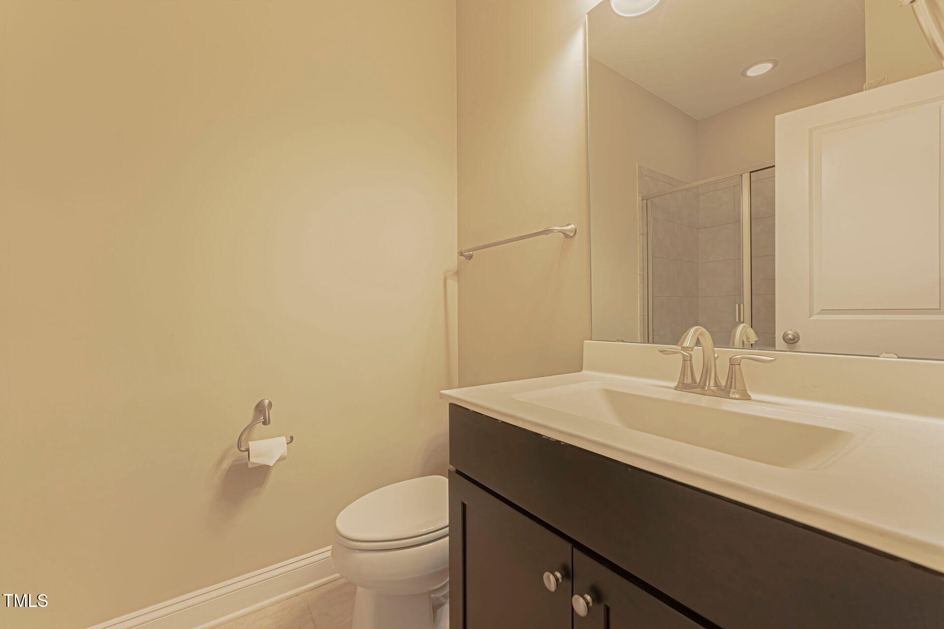 3606 Winifred Way Raleigh, NC 27609 - Photo 39 of 45 a bathroom with a sink a toilet and a mirror
