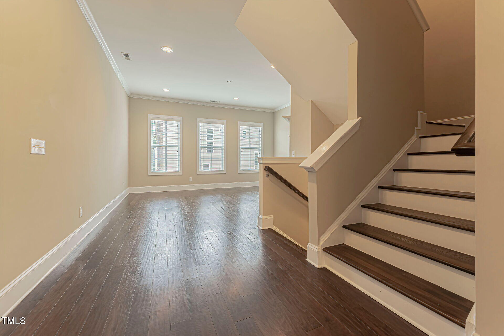 3606 Winifred Way Raleigh, NC 27609 - Photo 9 of 45 wooden floor in an empty room with a window