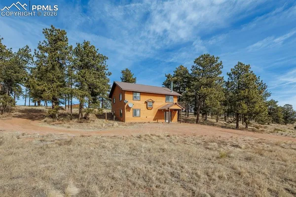 a house with trees in front of it