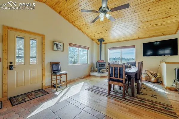 a view of a livingroom with furniture window and outside view