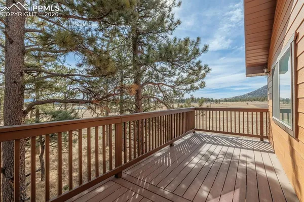 a view of deck with wooden floor and fence
