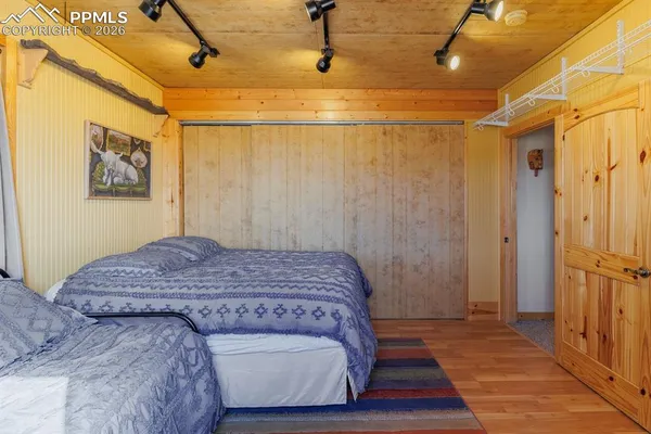 a bedroom with a bed and a table