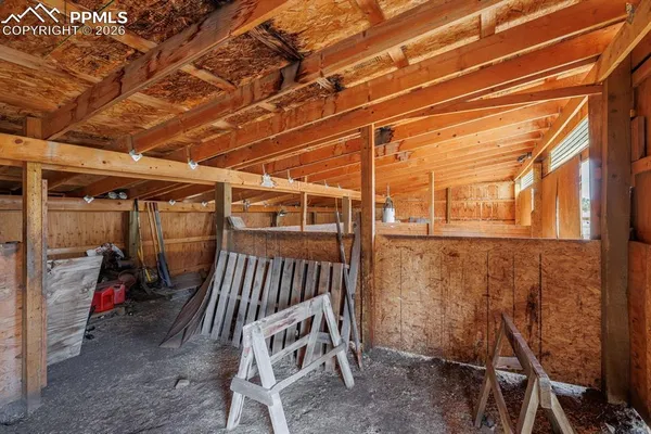 a view of a room with wooden walls