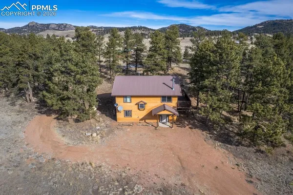 a view of a house with a mountain