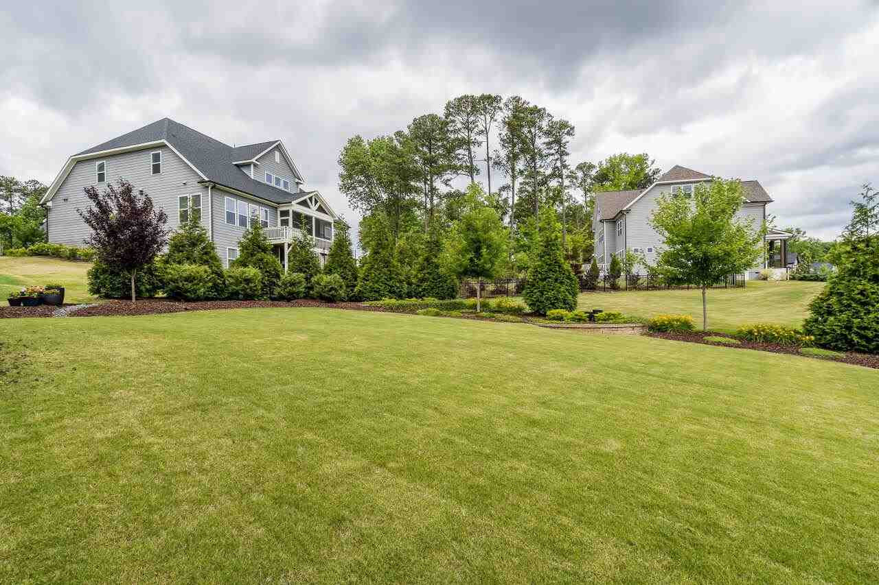 5268 Aleppo Lane Raleigh, NC 27613 - Photo 29 of 30 Luscious landscaping and plentiful hardscaping added to this yard along with irrigation! Backyard