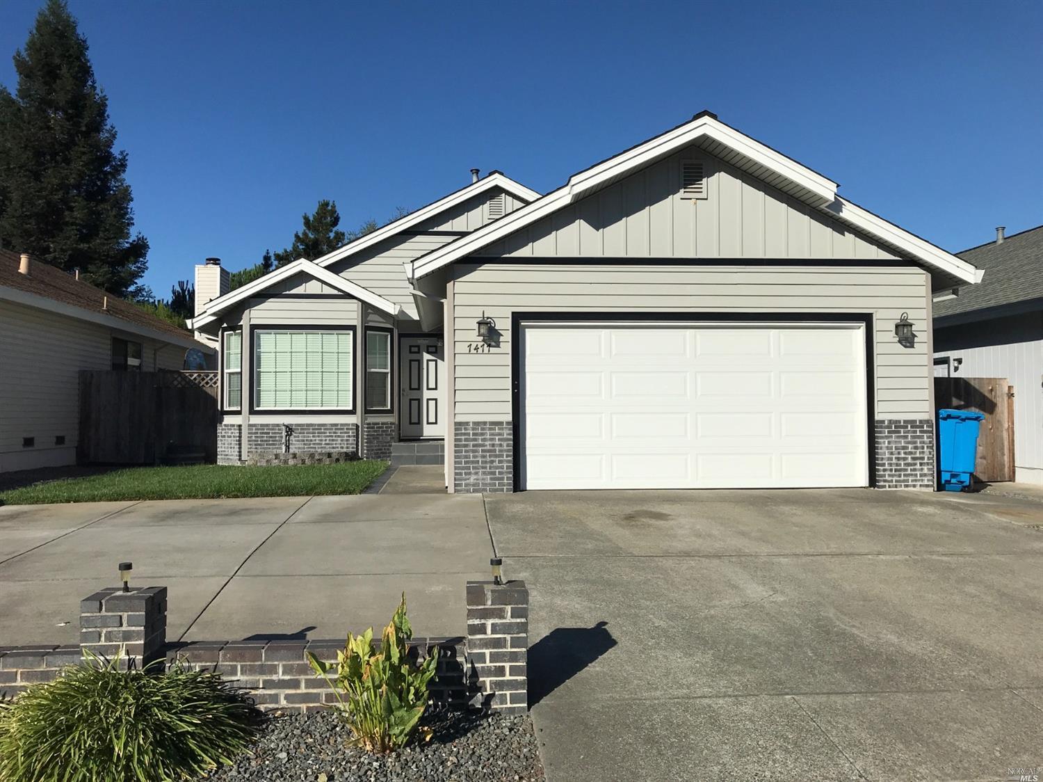 7477 Mercedes Way Rohnert Park, CA 94928 - Photo 1 of 1 a front view of a house with garden