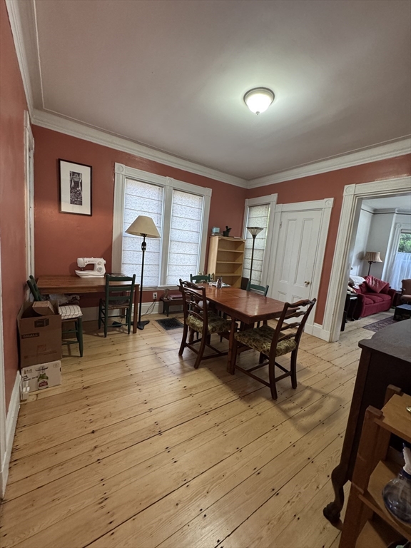 5 Spring Park Avenue, Unit 1 Boston, MA 02130 - Photo 5 of 24 a living room with dining room and wooden floor