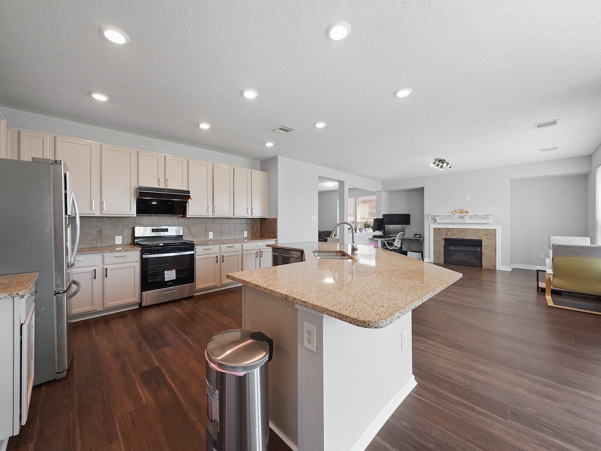 24131 Adobe Ridge Lane Katy, TX 77493 - Photo 11 of 37 a kitchen with granite countertop a sink a counter top space stainless steel appliances and cabinets