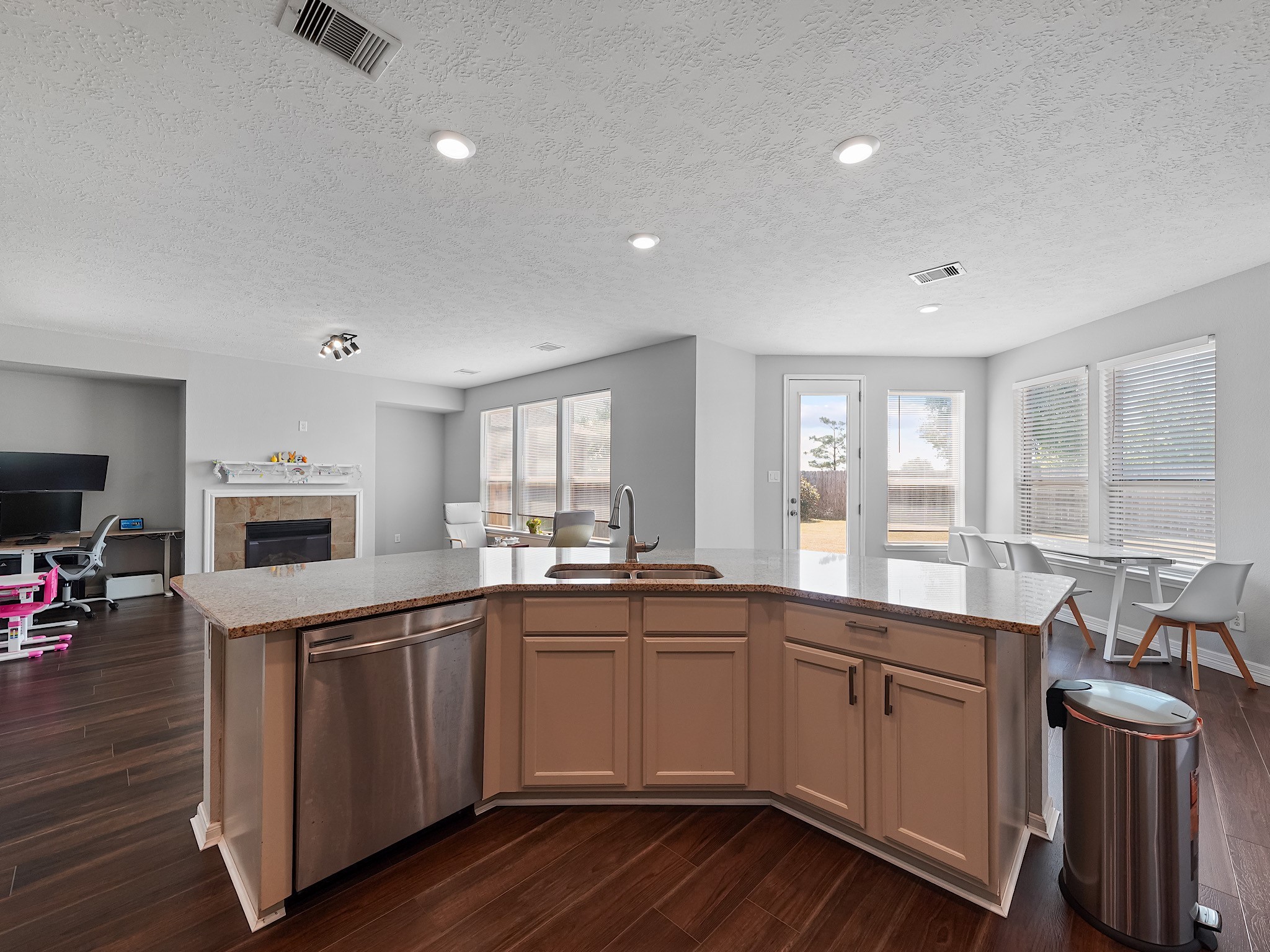 24131 Adobe Ridge Lane Katy, TX 77493 - Photo 13 of 37 a kitchen with sink cabinets and wooden floor