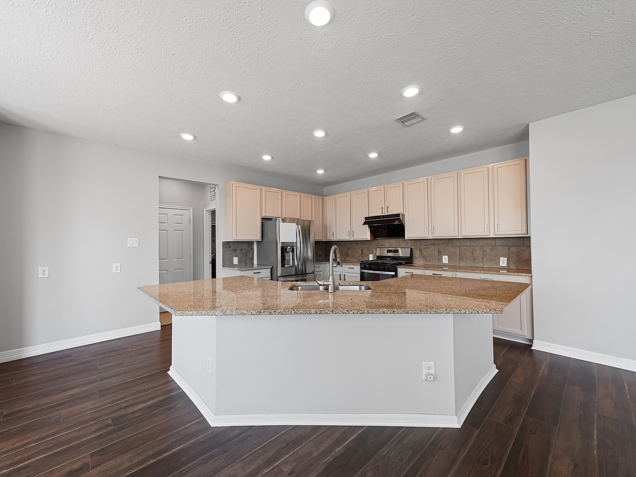 24131 Adobe Ridge Lane Katy, TX 77493 - Photo 14 of 37 a view of kitchen with stainless steel appliances granite countertop a sink a stove and a refrigerator