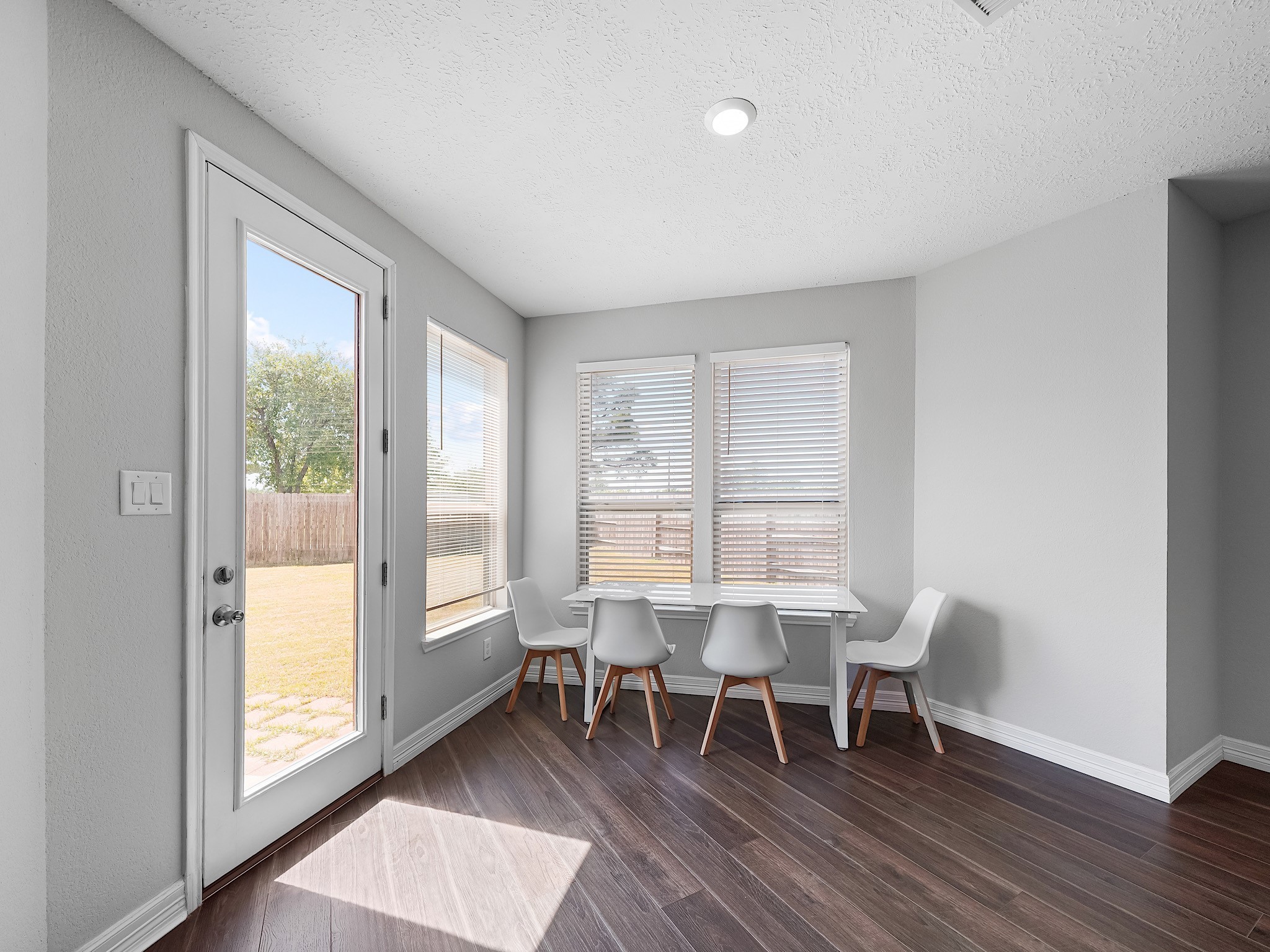 24131 Adobe Ridge Lane Katy, TX 77493 - Photo 15 of 37 a dining room with wooden floor and a window
