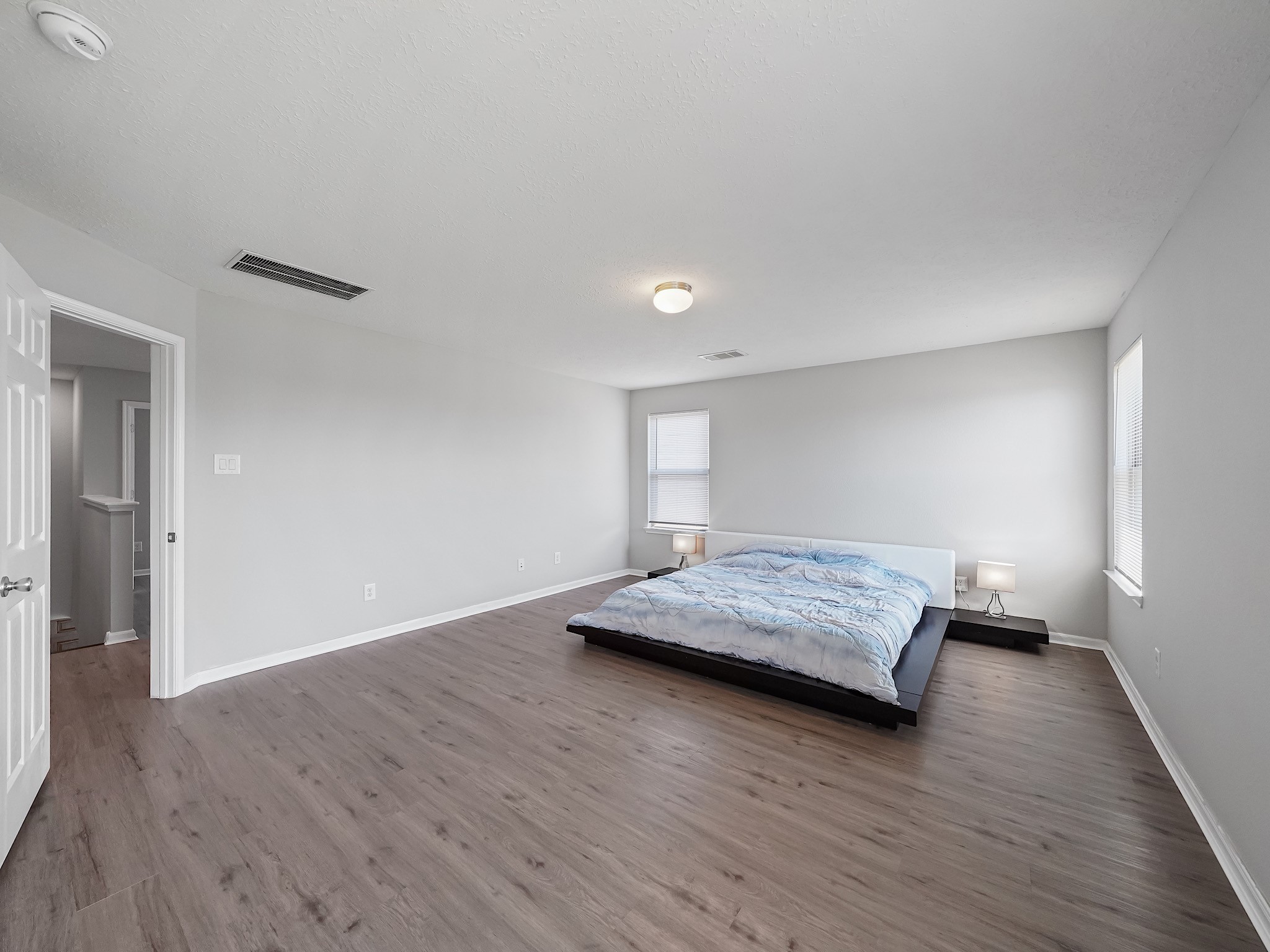 24131 Adobe Ridge Lane Katy, TX 77493 - Photo 20 of 37 a living room with hard wood floors and a ceiling fan