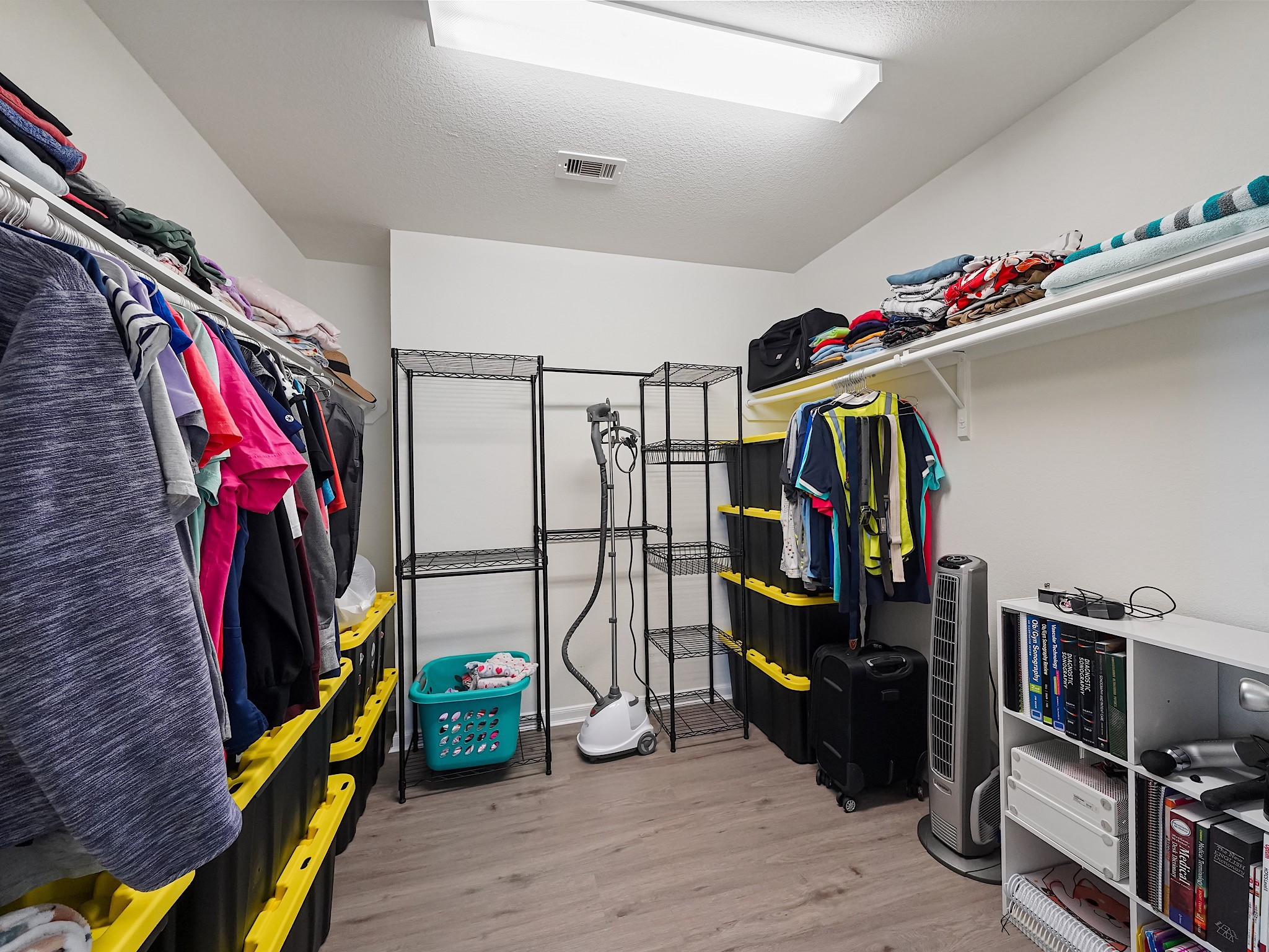 24131 Adobe Ridge Lane Katy, TX 77493 - Photo 25 of 37 a view of walk in closet with clothes