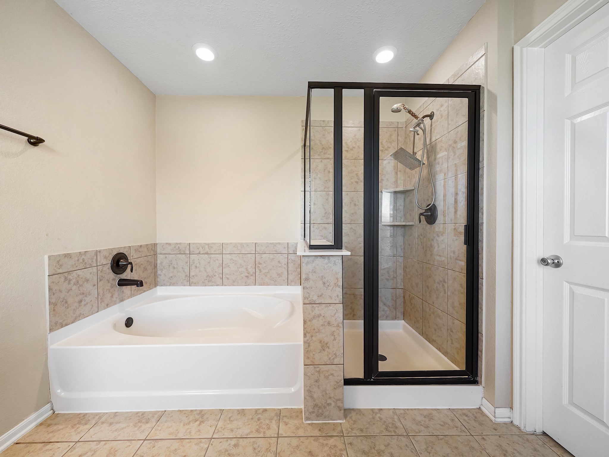 24131 Adobe Ridge Lane Katy, TX 77493 - Photo 27 of 37 a white bath tub sitting next to a shower