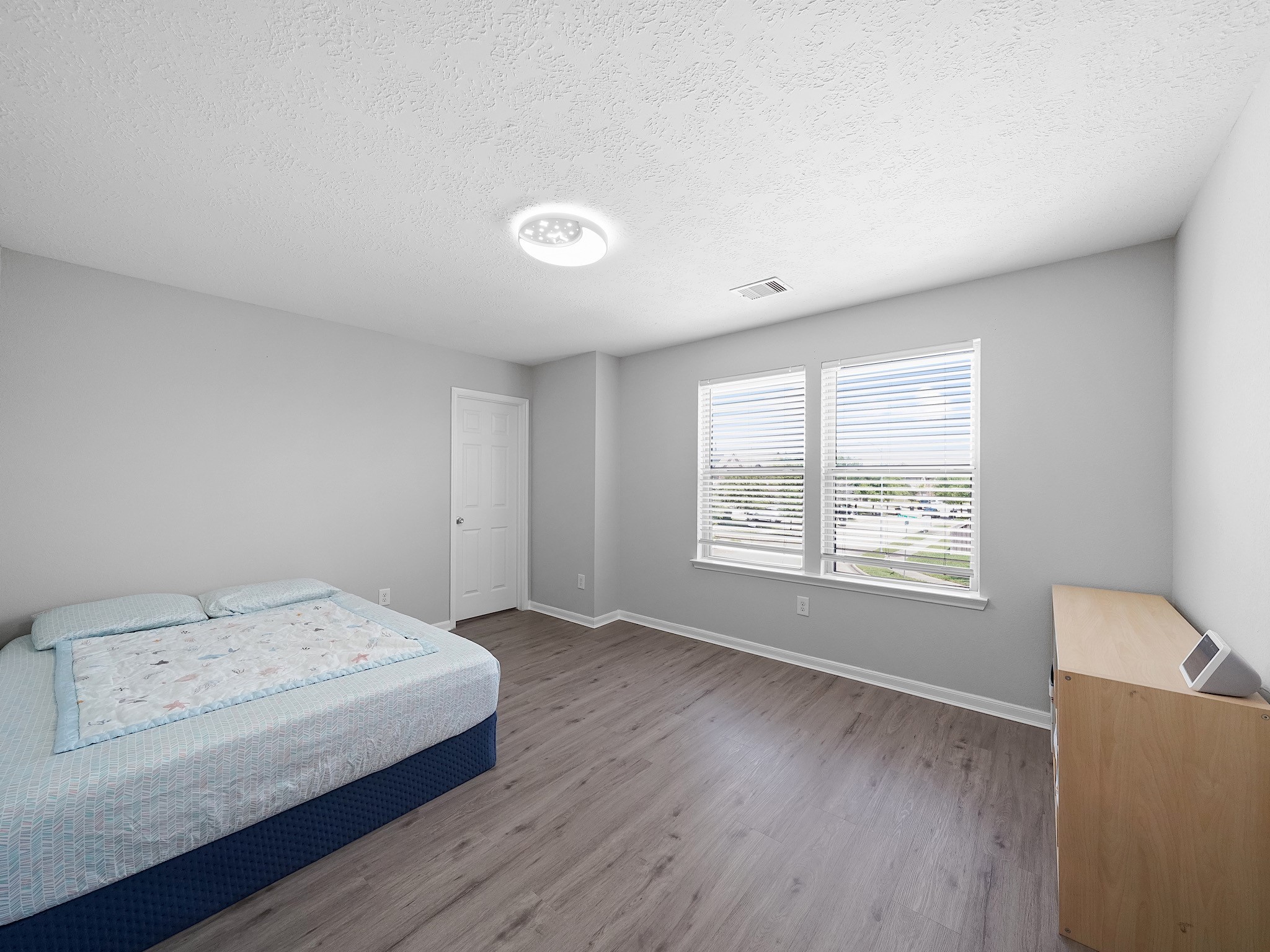 24131 Adobe Ridge Lane Katy, TX 77493 - Photo 28 of 37 a bedroom with a bed and a window