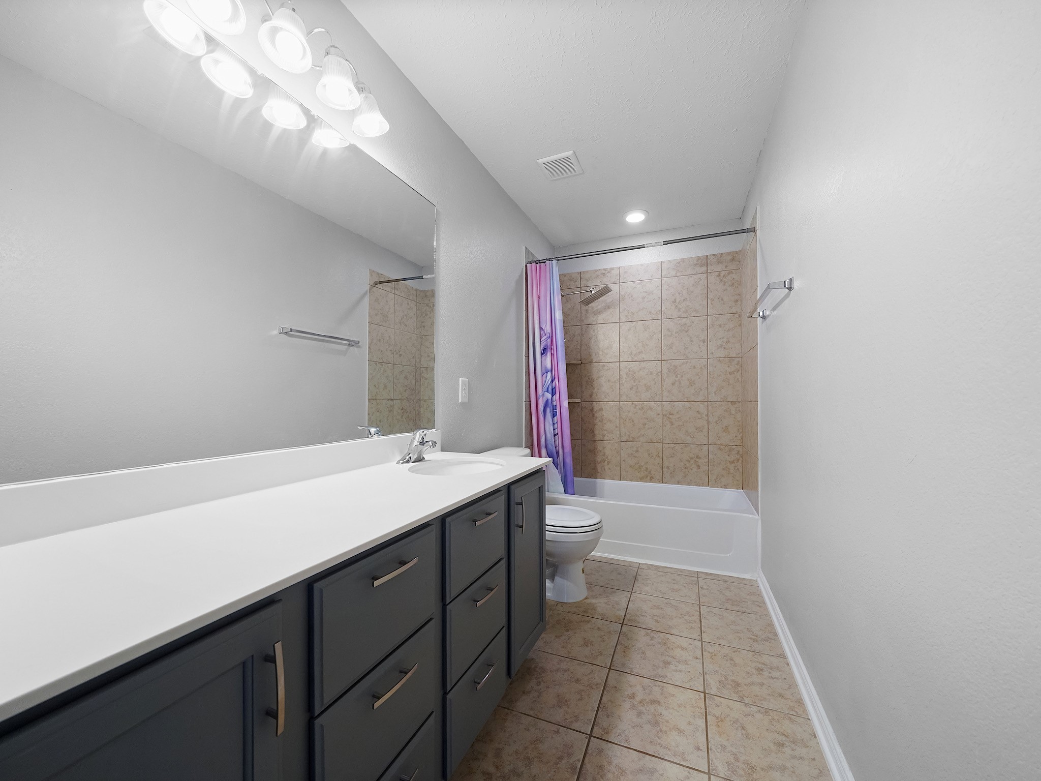 24131 Adobe Ridge Lane Katy, TX 77493 - Photo 31 of 37 a bathroom with a sink a toilet and shower