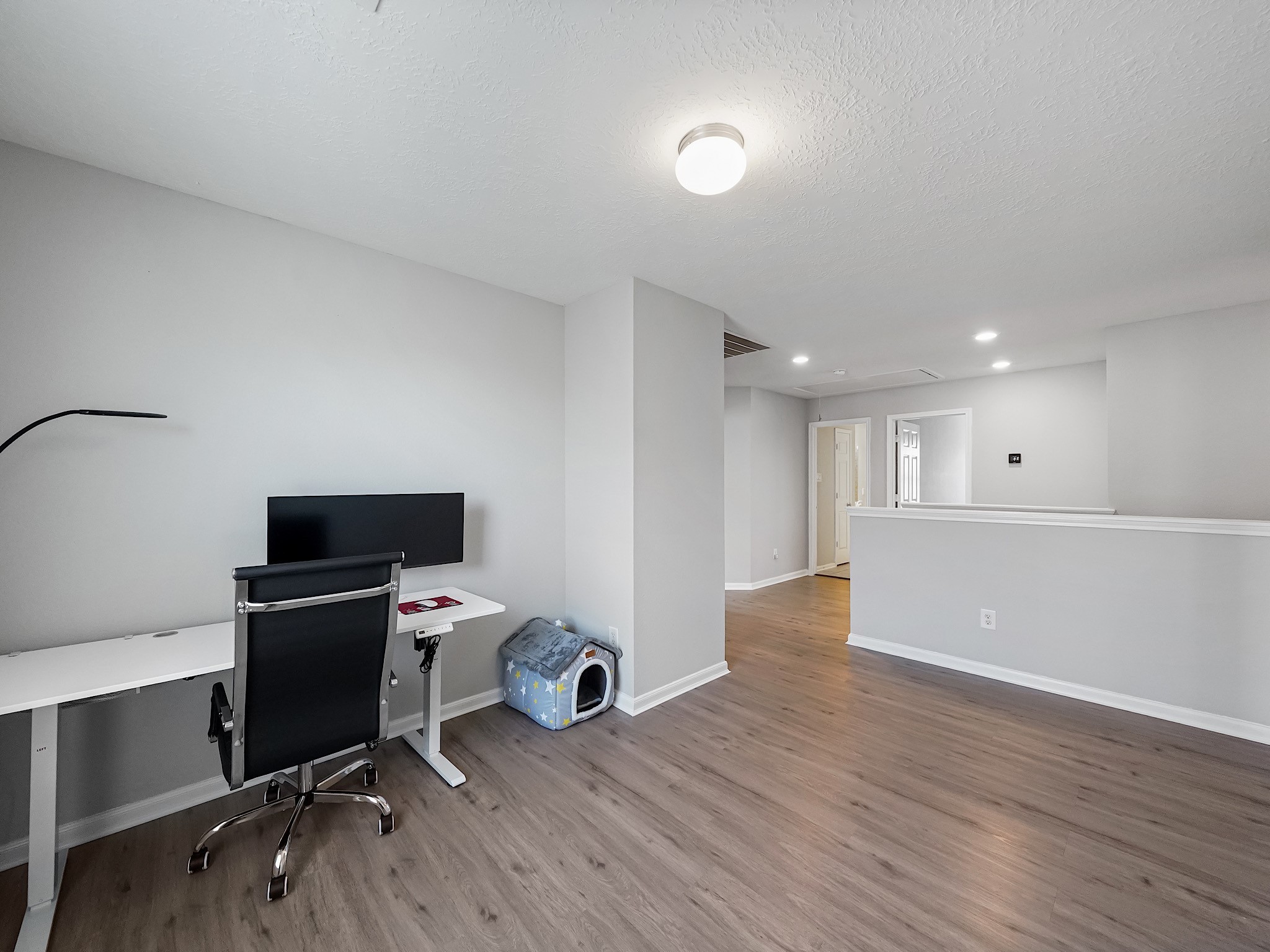 24131 Adobe Ridge Lane Katy, TX 77493 - Photo 33 of 37 a view of a workspace with furniture and wooden floor