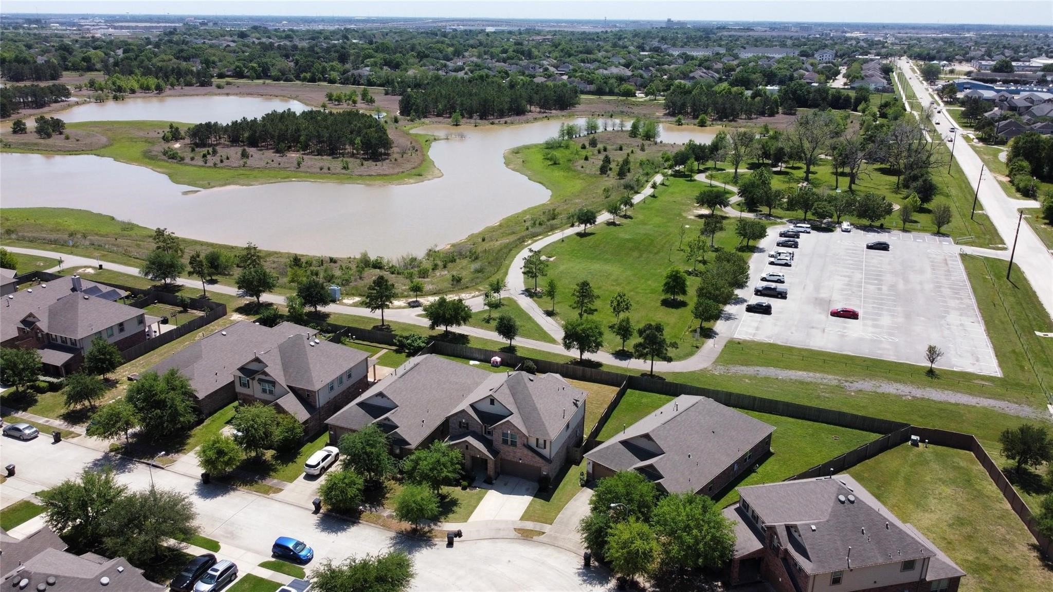 24131 Adobe Ridge Lane Katy, TX 77493 - Photo 35 of 37 an aerial view of a house with a lake view